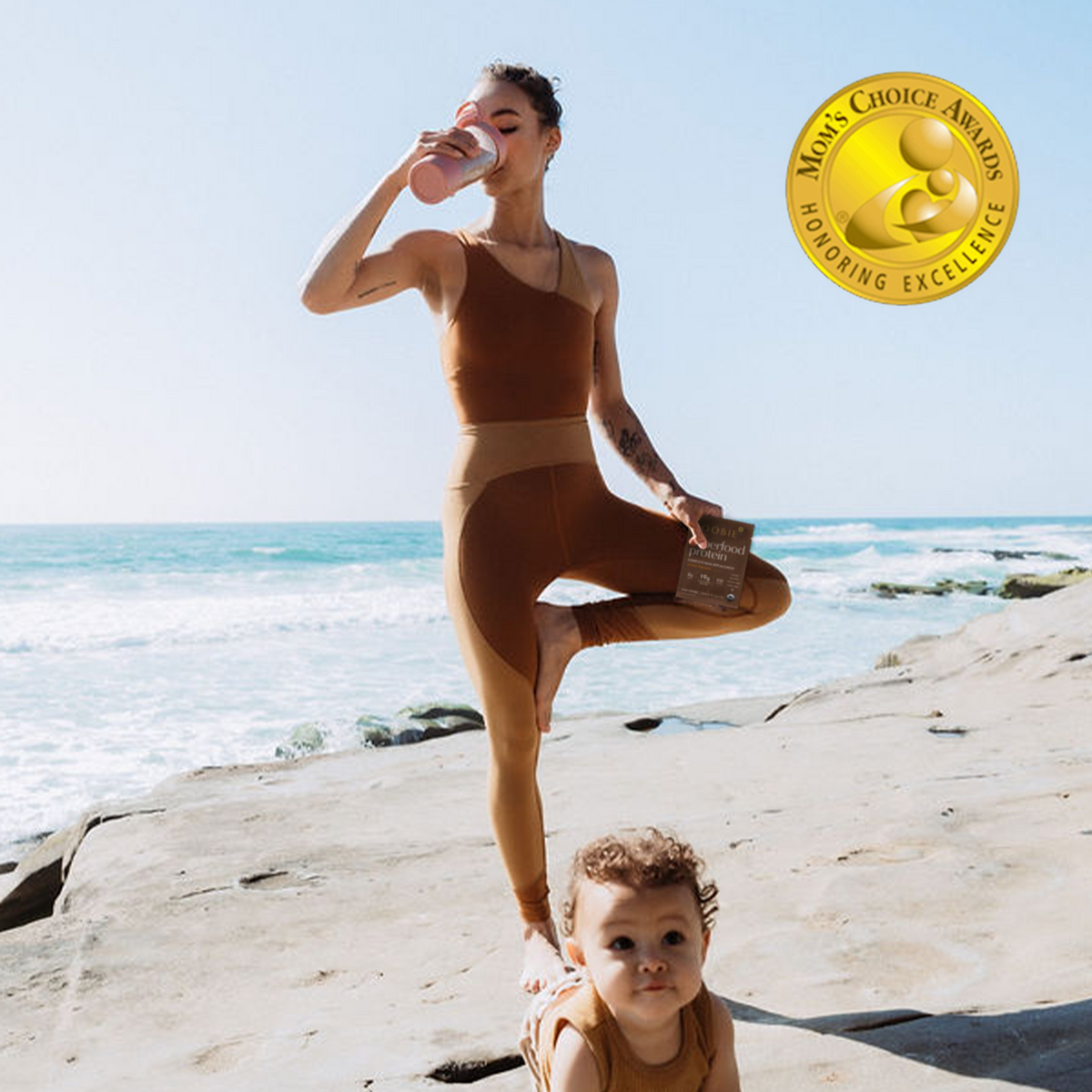 Women doing yoga on the beach while drinking a protein shake